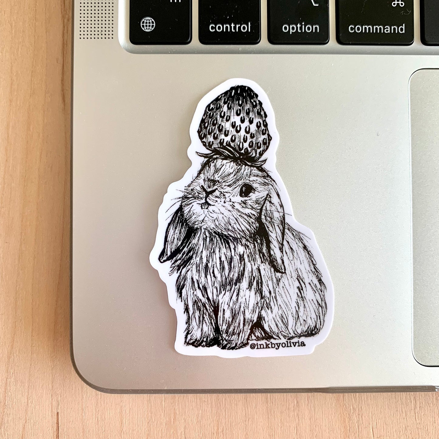 Adorable bunny with a strawberry hat, cute design.