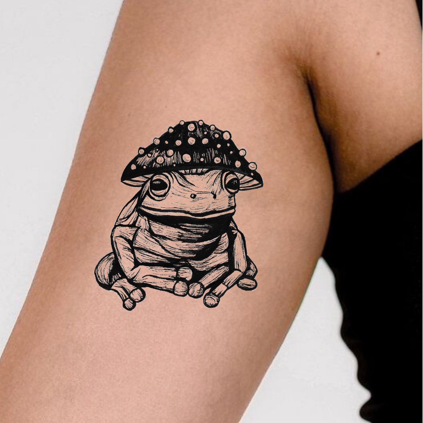 2-inch Fungi Frog Temporary Tattoo featuring a whimsical frog and mushrooms, water-resistant and skin-safe ink.